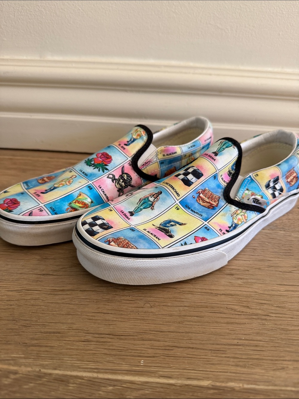 Vans Slip-On Sneakers in Pastel Multi Lotería Print